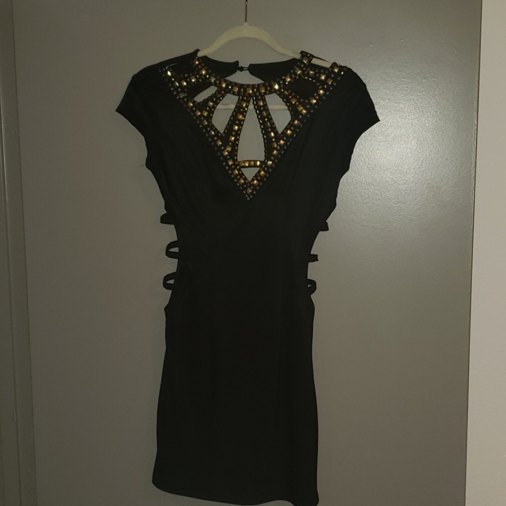 Little black dress with gold accent and cutouts